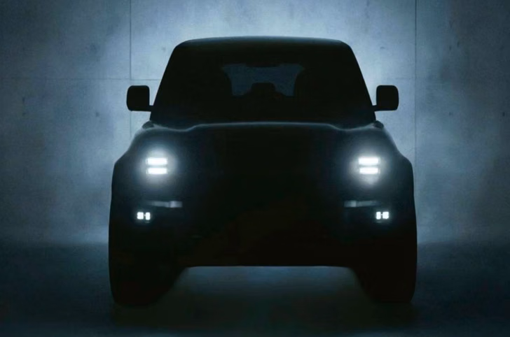 JSW Motors upcoming SUV teaser with LED headlights in dark studio