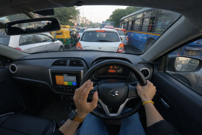 Driver’s perspective inside a compact car navigating city traffic during daytime