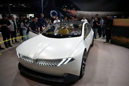 BMW sales drop 2026 luxury car showroom global deliveries decline