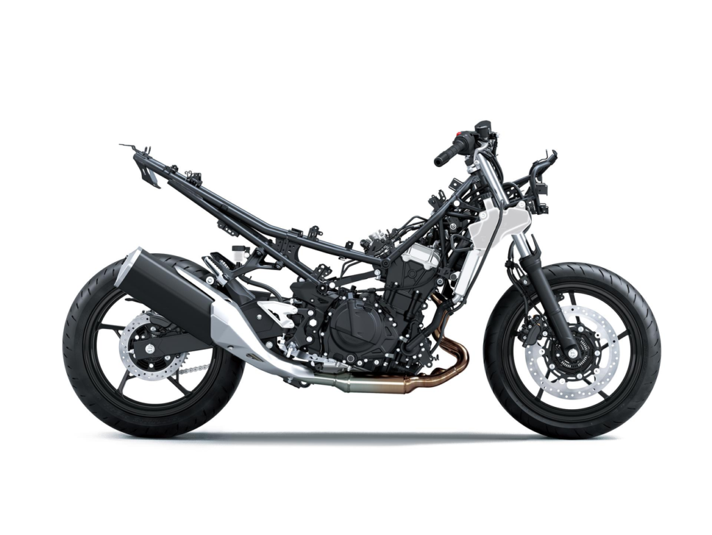 2026 Kawasaki Ninja 500 lightweight trellis frame and chassis illustration, highlighting the compact frame design inspired by the Ninja H2. The graphic showcases the rigid-mounted engine acting as a stressed member, optimized rigidity, mass centralization, and low weight construction that contribute to agile handling, easy maneuverability, rider confidence, and a light estimated dry weight of 157 kg.