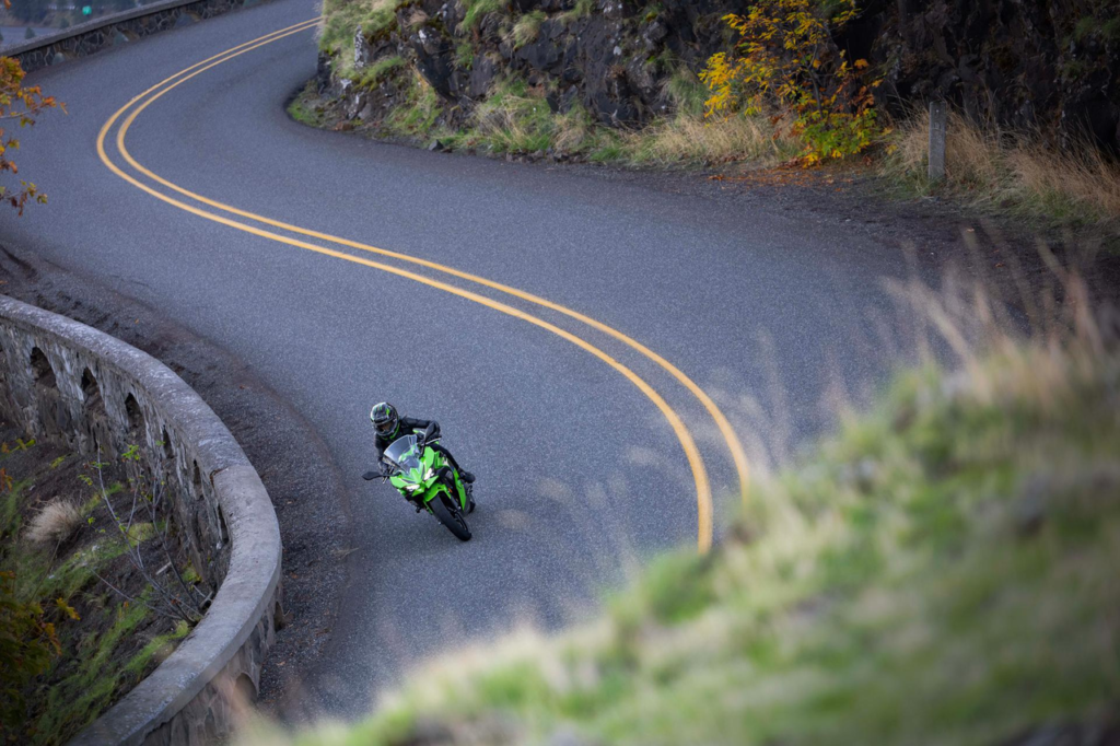 2026 Kawasaki Ninja 500 sports bike in profile view, featuring aggressive Ninja styling, sharp aerodynamic fairings, LED lighting, and a 451cc parallel-twin engine. Lightweight sport motorcycle designed for daily riding, highway touring, and beginner-friendly performance.